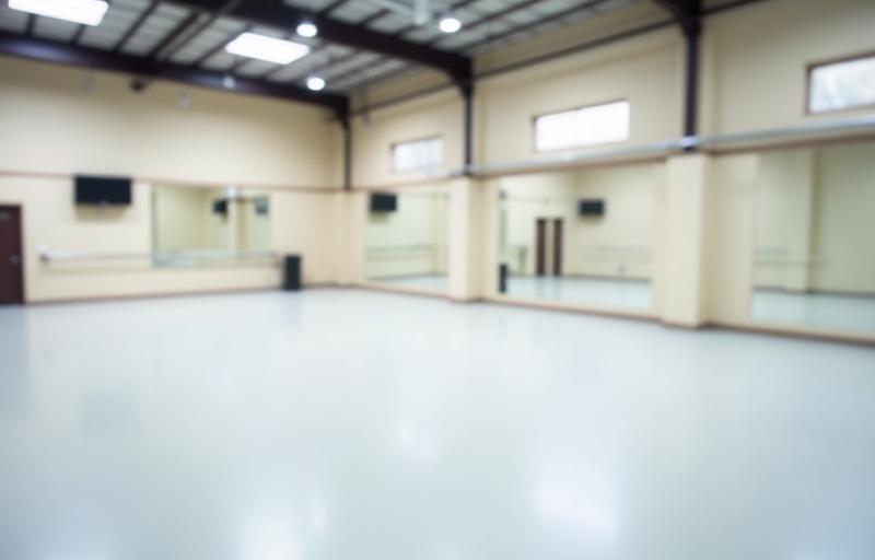 Interior view of the spacious and well-lit academy studio space.